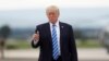 President Donald Trump gives a thumbs-up as walks to board on Air Force One at Hagerstown Regional Airport in Hagerstown, Md., Friday, Aug. 18, 2017, following a national security meeting at Camp David. 