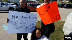 Flint city: Protesters waving banners