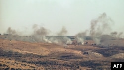 A picture taken from the southern Lebanese area of Marjayoun on July 3, 2024, shows smoke billowing over hills in the Israeli-annexed Golan Heights after rockets were fired from the Lebanese side of the border.