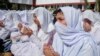 Students pray for the speedy recovery of schoolgirl Malala Yousufzai at a college in Peshawar