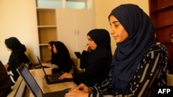 In this photo taken on Sept. 4, 2019 Afghan students attend a class at the Code to Inspire school in Herat.