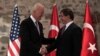 U.S. Vice President Joe Biden, left, and Turkish Prime Minister Ahmet Davutoglu shake hands before a meeting in Istanbul, Turkey, Nov. 21, 2014. 